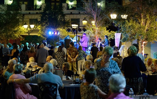 The area in front of the band's stage is left free of highboy tables, so guests can get closer to the band. The area is open enough for dancing too!