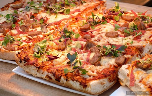 The Focaccia Pizza features tomato ragu, cured meats and mozzarella cheese.