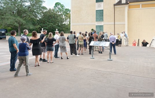 The "Standing Harbor" Ticket Check-In line was outside the Portofino Bay Hotel. If you're looking directly at the lobby, this area would be to your left. Interestingly, the stairs you see on the right hand side of this photo, lead down to where the Harbor Nights event takes place.