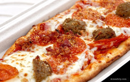 The "Three Meat" Pizza at Dockside Pizza Company combines Pepperoni, Italian Meatballs, and Bacon with Mozzarella Cheese and Parmesan.