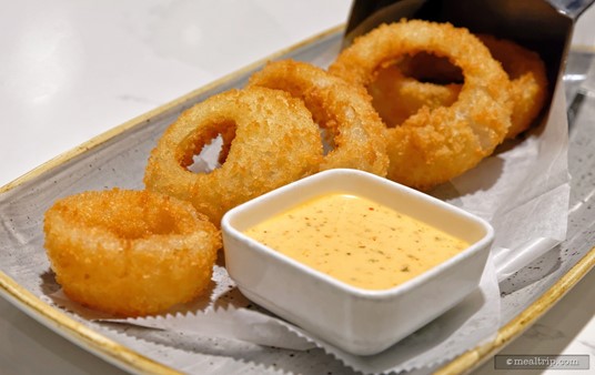 The Steakhouse71 Onions Rings are hand-breaded and served with Spicy Ranch Dipping Sauce.