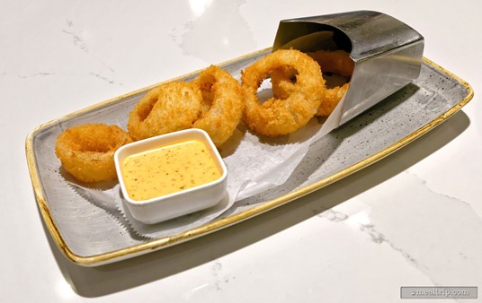 The Steakhouse 71 Onion Rings are on the lounge menu and the lunch & dinner menus as an appetizer over on the restaurant side.