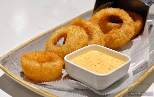 There were five onion rings on the "Steakhouse 71 Onion Rings" appetizer item, along with a dipping sauce.