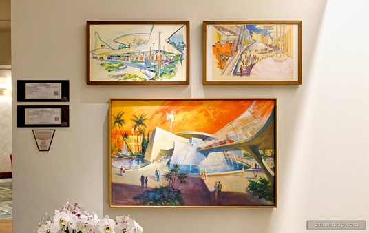 While you wait for your table, near the reception booth, there's some very cool concept art from the opening days of the Magic Kingdom. Pictured here are some Tomorrowland concepts.