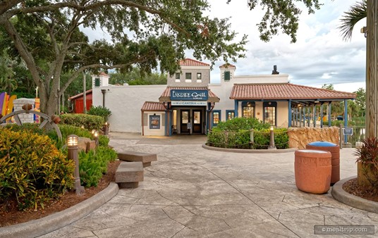 Here's a look at the main entrance to the Lakeside Grill Cantina at dusk. It's a little easier to see the outdoor covered patio area on the right of the photo. You can get to the patio from just behind the plants near the front door, and there's another door just past the check-out counter inside Lakeside Grill.