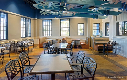 Here's a photo of the dining area that's near the main entrance of the restaurant. This photo was taken from the walkway that leads to the outdoor patio area. The see-through fish tank is on the far right. (It's the glass panel that looks sort of like a tv screen... but it's not. There's fish behind that glass.)