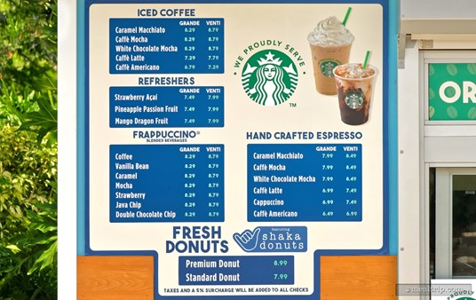 The menu board with prices at the Coaster Coffee Company Express. (Photo taken summer 2024). The prices are (more or less) the same as they are at the larger Coaster Coffee Company location near the front entrance of the park.