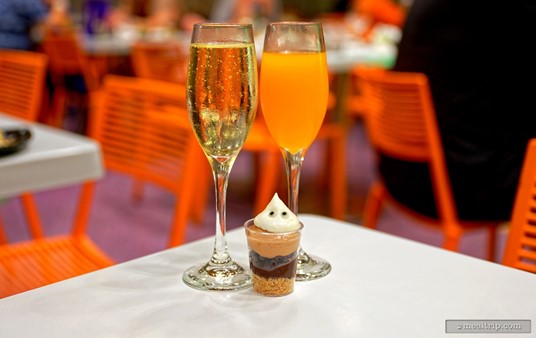 On the left is a flute of "The Lady of Spain Brut" (a Spanish sparkling Cava) and on the right is a flute of POG Juice.