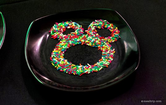 Okay, this one I know — it's a hidden Mickey made out of icing and sprinkles!