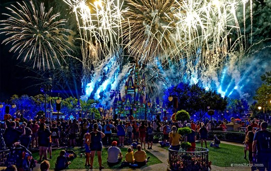 It does appear that (some guests) stayed seated for the fireworks show — which there is room to do in the reserved "Plaza Garden Viewing" area. You can't do that in the "general guest" areas — just look at that sea of people just past the low iron gates of the protected area.