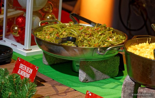 Each of the warm food items were set up on two cement blocks or a food-service grade sterno "keep-warm" device. There's a small can of sterno under each dish keeping the whole plate warm.