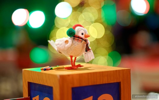 The table top centerpieces are not "unique" to each table, per say. There's maybe a half dozen different items. This cute little scarf wearing bird was on several tables.