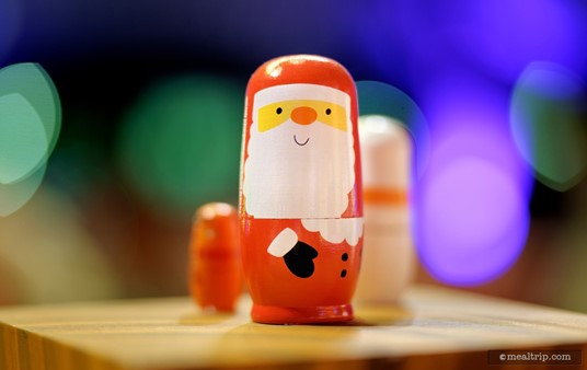 Ahhhh.... a classic Santa nesting doll set is used as a centerpiece at this table.