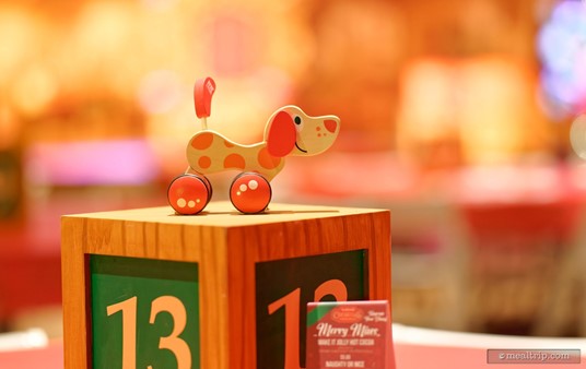 Here's a toy pull-string dog on top of table number 13's centerpiece block.