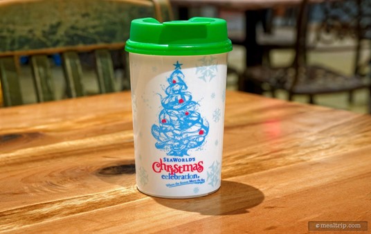 Each guest at the "Cookies, Cocoa, & Milk Party Featuring a Special Holiday Guest" received this cool little sippy cup — which was filled with either hot chocolate or milk. This is your cup for the event, if you wanted a refill of anything, it would be poured in this cup... i.e. they're not going to give you a new plastic cup each time.