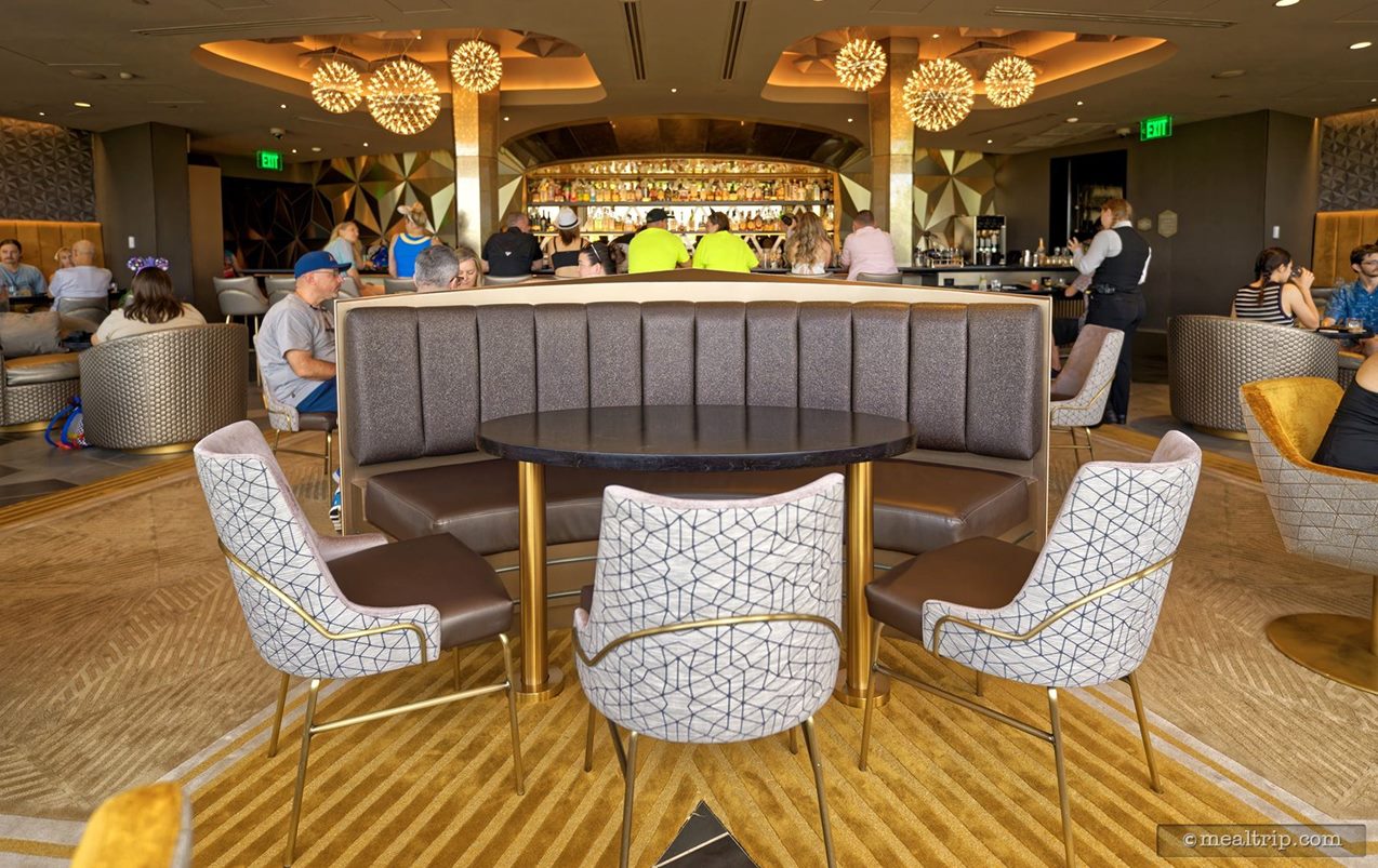 This is "the" center table at Geo-82. It's in the very middle of the room and if the people sitting in the booth can see over the heads of the people sitting in those chairs – they'll get a straight-on view of the tree garden outside the window.