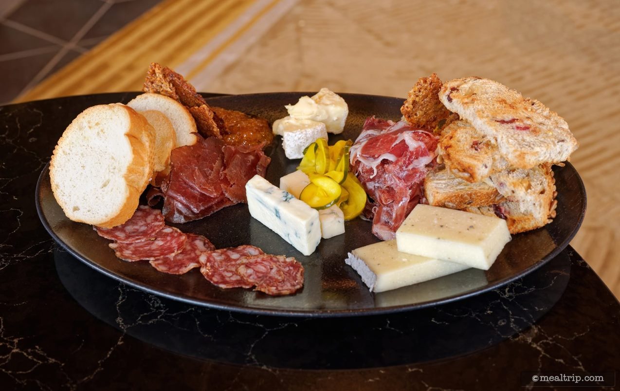 Even though they don't call this a Charcuterie on the Geo-82 menu, it does more closely follow the 3-3-3-3 rule for a good charcuterie – than I've seen on some other Disney menus.