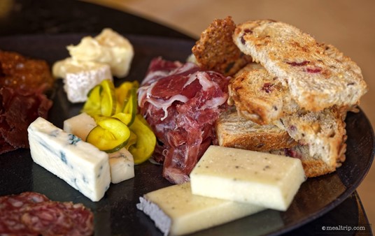 There were three meats, three cheeses, three accompaniments, and three bread(like) elements on the Geo-82 charcuterie. This photo shows all three cheeses and the right side of the plate.