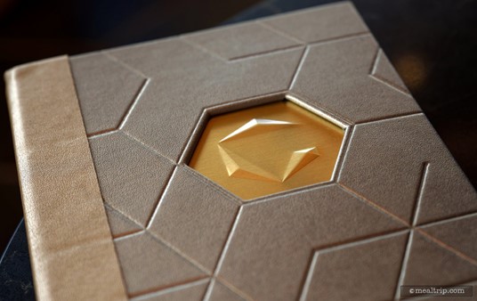 The menu cover is very cool. The Geo-82 G Logo is carved into the cover through multiple layers of embossing, debossing, and various coverings.