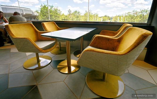 Because of the way the a/c is set up, and depending on the time of day, it may be slightly warmer by the window when compared to sitting deeper in the lounge area.