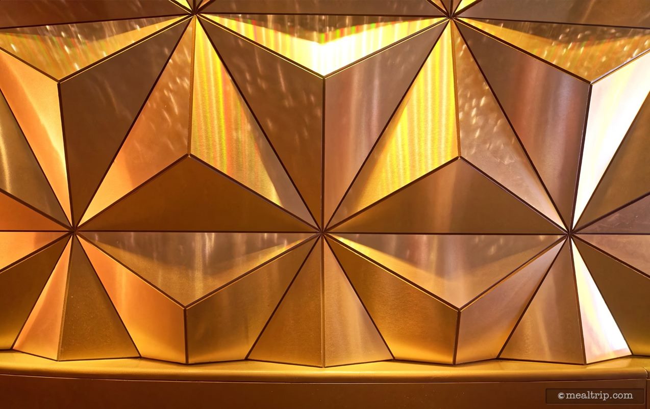 These tiles line the wall of a walkway that leads from the second waiting room to the main lounge room at Geo-82.