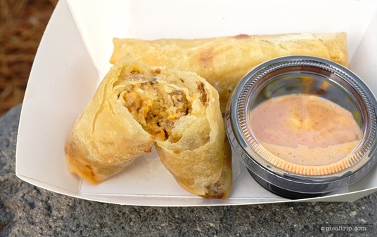The Cheeseburger Spring Roll is moderately stuffed with chopped ground beef, some diced pickle and onion pieces and melted cheese. The flavors of a Disney Cheeseburger – are all in there.