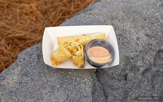 The paper tray our Cheeseburger Spring Rolls were served in, was white and slightly wax coated. While the Spring Rolls didn't really "drip", they did have a fair amount of cooking oil on the bottom side. When using the natural colored paper trays, they would hopefully include a coated paper sheet to separate the roll from the tray.