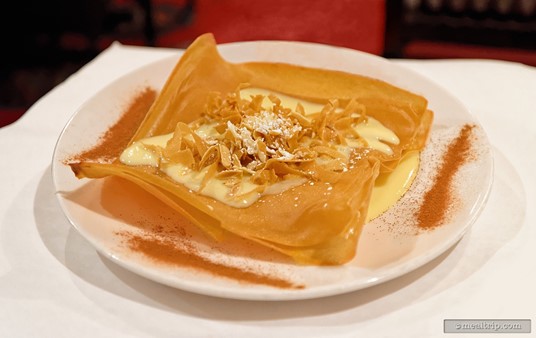 The unique Bastilla combines layers of phyllo dough, fried almonds and an orange custard cream anglaise, with a dusting cinnamon.