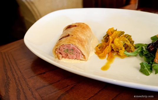 The Rose and Crown's Pork and Apple Sausage Roll with house-made 
Piccalilli to the right, is one of two meat pies on the House-made 
English Meat Pies appetizer.