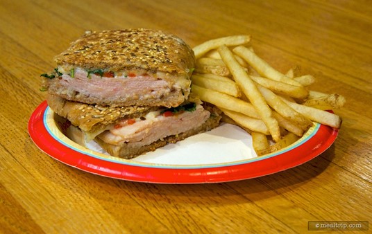 Grilled Turkey and Cheese
            - Multigrain Ciabatta, Arugula, and Red Peppers served with French Fries.