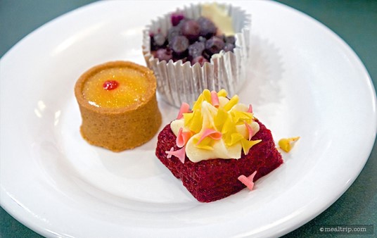 A trio of mini desserts including the key lime tart, red velvet cake, and blueberry cheesecake.