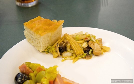 Fresh Focaccia bread and one of the chilled chicken and vegetable prepared salads from the beginning of the buffet line.